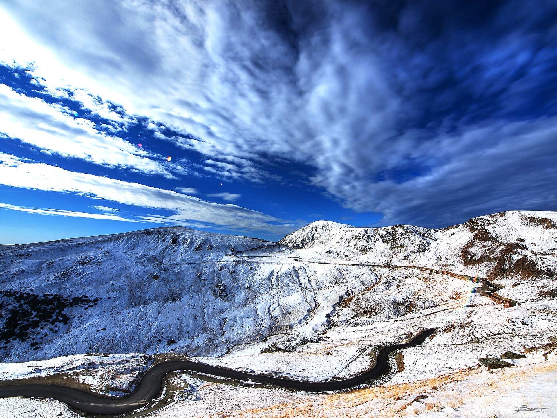 The Transalpina in winter, winding between snow-covered slopes